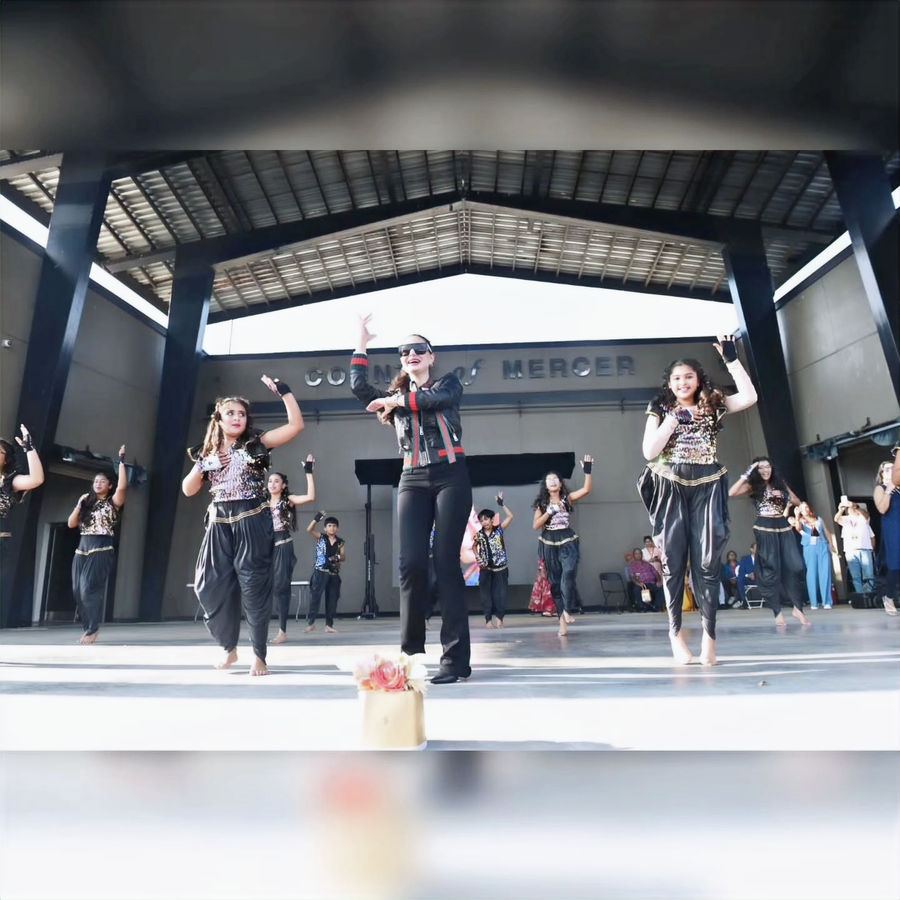 Dance4Ever dancers performing on an outdoor stage
